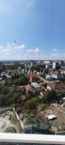 Very profitable two-level three-room apartment with a view of the city center in a rented and inhabited house