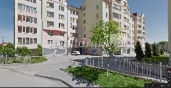 The apartment is in a new building with a large area repairs Street Trolley