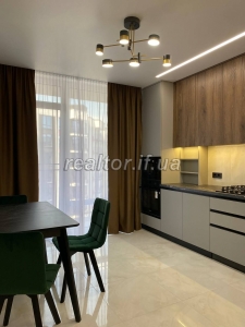 Sale of an apartment in the Family Plaza residential complex with modern renovation and furniture
